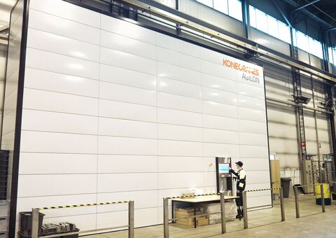 BE Group employee picking up items from the automated warehouse Agilon user access point.