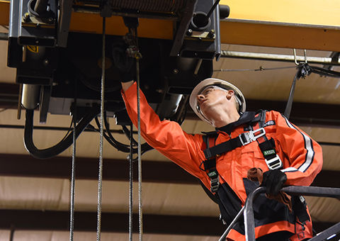 Konecranes technician inspecting hoist