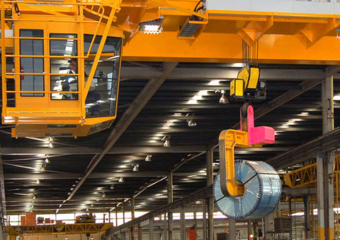 Overhead crane with operator cab.