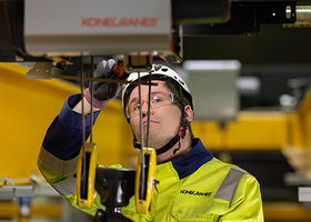 Technician inspecting crane