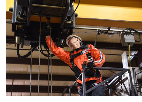 Technician works on crane